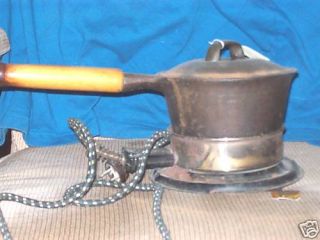 antique? cast iron pot with lid with cooking element
