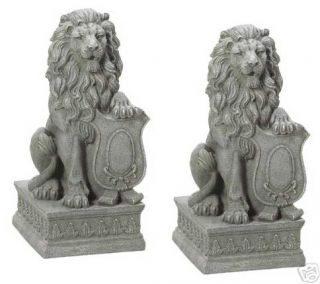 Two (2) crested shield lion garden statues, yard lions