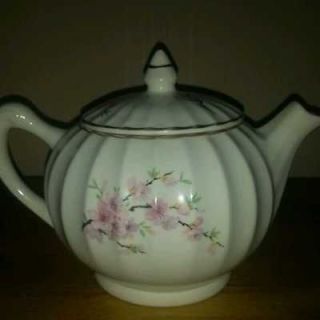 Vintage Antique porcelain tea pot with unique design and 22 kt gold