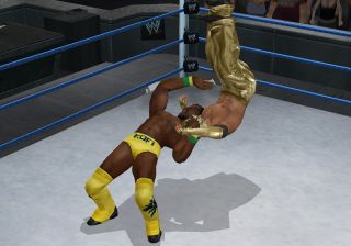 Kofi laying a suplex on Mysterio in WWE Smackdown vs Raw 2010 for PSP