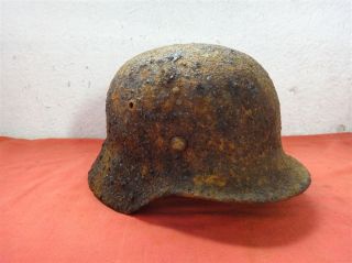 WWII original Wehramcht helmet M 40 sz64 , bullet wound damaged relic.
