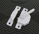white metal latch for sliding and folding doors or windows.