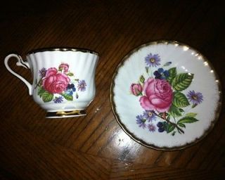   Tea Cup and Saucer Bone China Made in ngland Red Flowers Gold Trim