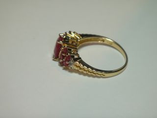 LOVELY RING. THE CENTER RUBY IS APPROX 2.25 CARAT. IT MEASURES 8MM 
