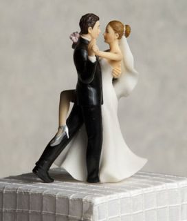   is well in tow with this funny super sexy dancing wedding cake topper