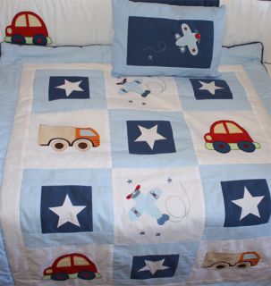 This bedding design combines white, baby blue and dark blue trim and 
