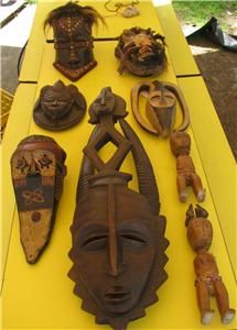 antique african masks and two african figurines