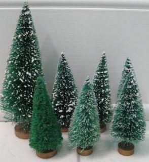 This lot of 23 vintage bottle brush Christmas trees range in size from 