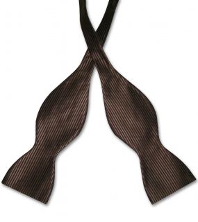   polyester (SILK feel) self tie bowtie is 2.5 inches (~6.4 cm