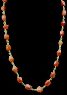Egyptian necklace with carnelian and green, white and yellow faience 