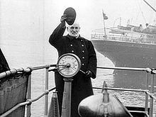 Captain (nautical)captain waves aboard a Cunard Line vessel.