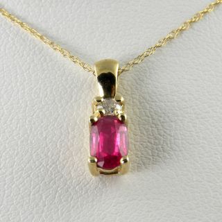 56 CT Total Weight Ruby and Diamond Pendant 10KT Yellow Gold