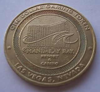 Coin description: MANDALAY BAY ONE DOLLAR COIN GAMING TOKEN