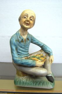 Ceramic Old Bald Man Approx 5 Sitting in Grass Holding Corn China