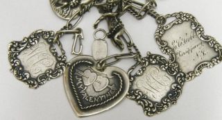 Featured is a beautiful T. Foree valentine charm bracelet with seven