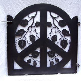 this peace symbol garden gate is cut from a single piece
