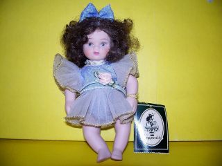 Small Porcelain Strung Geppeddo Doll 6 1 2 Tall Brunette Blue Dress