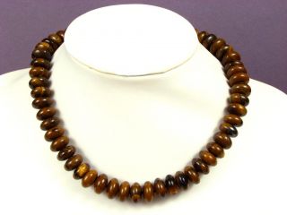 this necklace is made from around many pieces of tiger iron gemstones