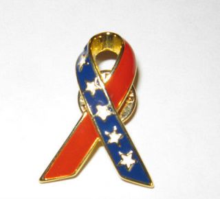 listed Patriotic goldtone and enamel red, white, and blue ribbon pin