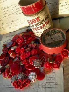 Collection vintage red buttons in antique phonograph box
