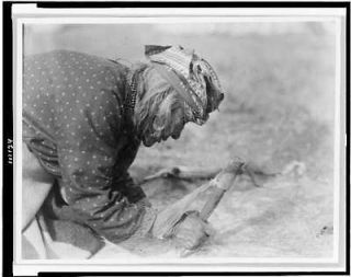 Blackfoot Indian fleshing hide,c1927,Sik sika Indian,Edward S Curtis