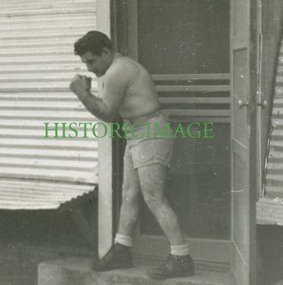1940 Shirtless Bodybuilder or Boxer outside Quonset Hut