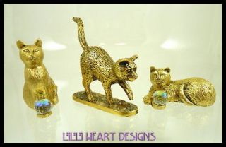 THREE GOLD PLATED PEWTER CATS WITH SWAROVSKI CRYSTAL